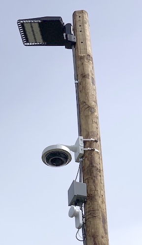 Camera and radio backhaul on pole